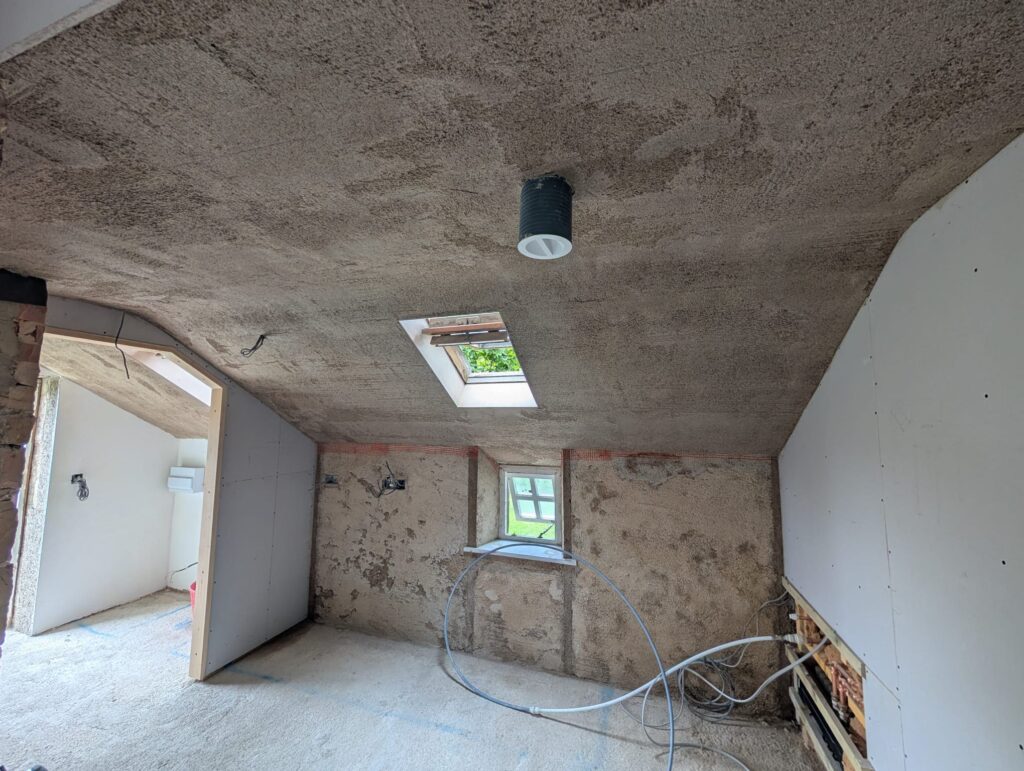 Diathonite insulated lime base coat being applied Northumberland